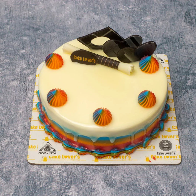 Cake with a rainbow decoration on a gray surface