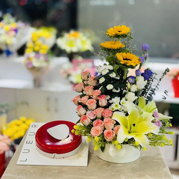 Vibrant Sunflower, Rose, & Lily Floral Box with Red Glaze Cake
